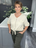 Cream V neck tie top