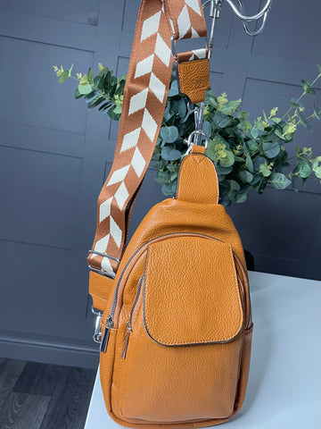 Tan Sling bag with wide colourful strap