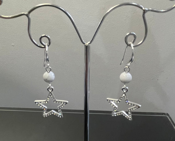 Silver tone drop star earrings