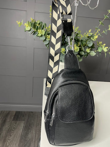 Black sling bag with wide colourful strap